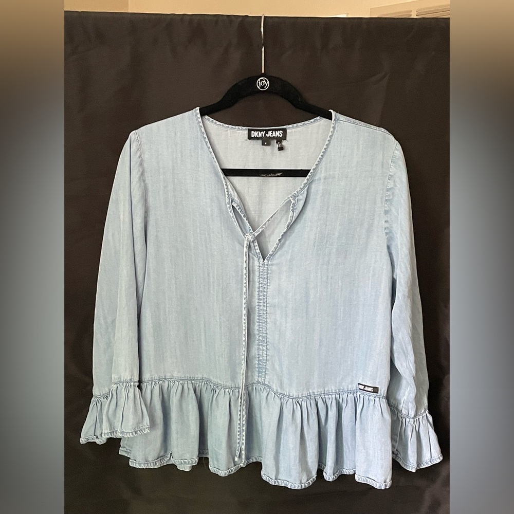 DKNY blue flowy blouse Size M. Ruffle sleeves and bottom.